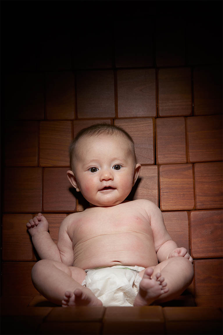 Studio portrait of child sitting