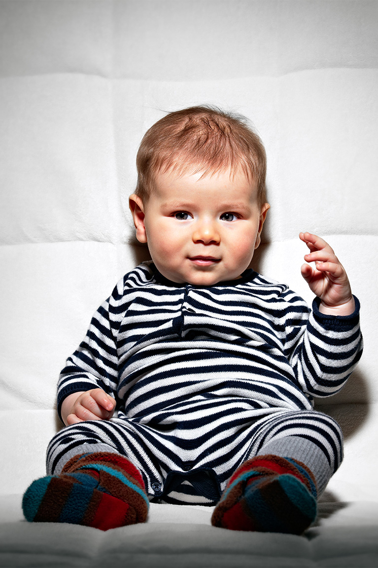 Studio portrait of child sitting