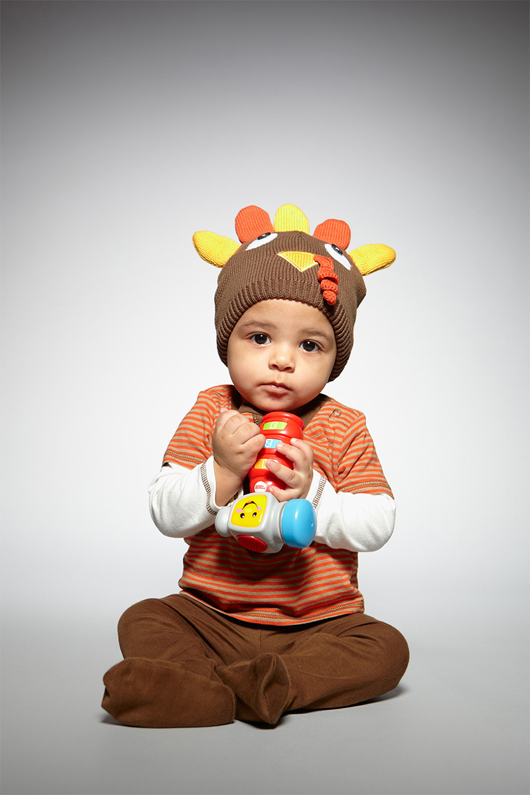 Studio portrait of toddler on gray background