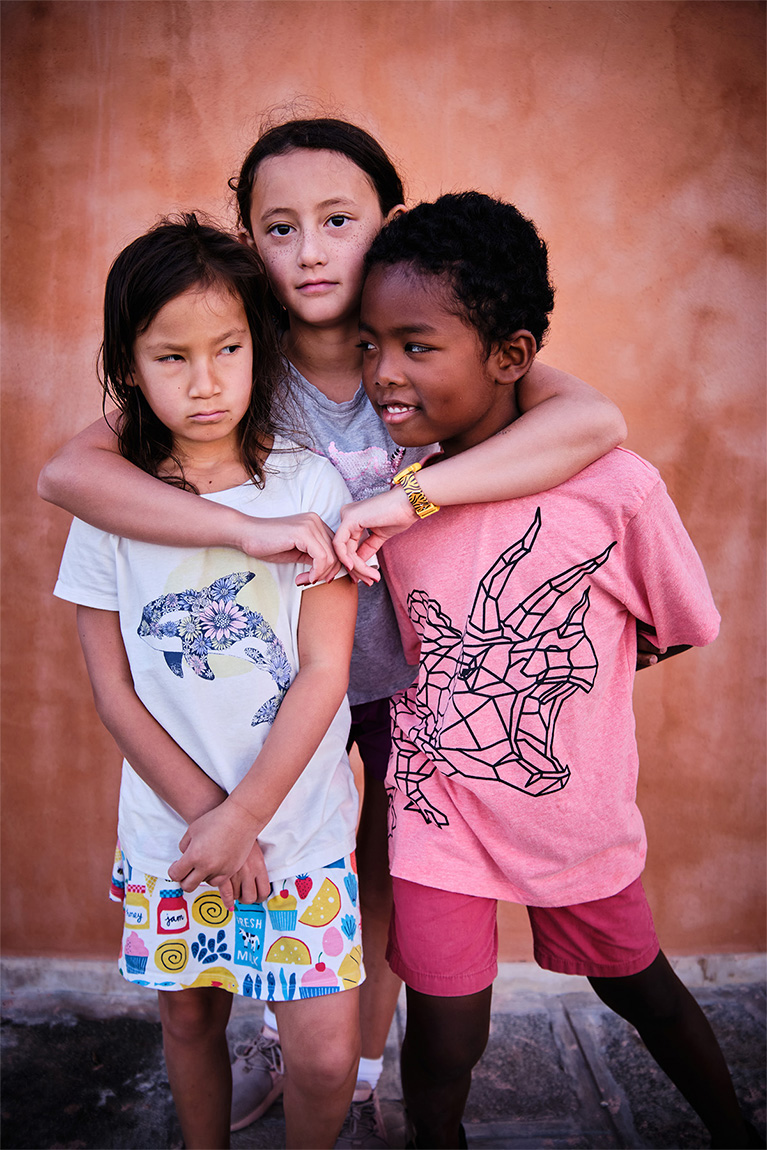 Outdoor, natural light portrait of cousins
