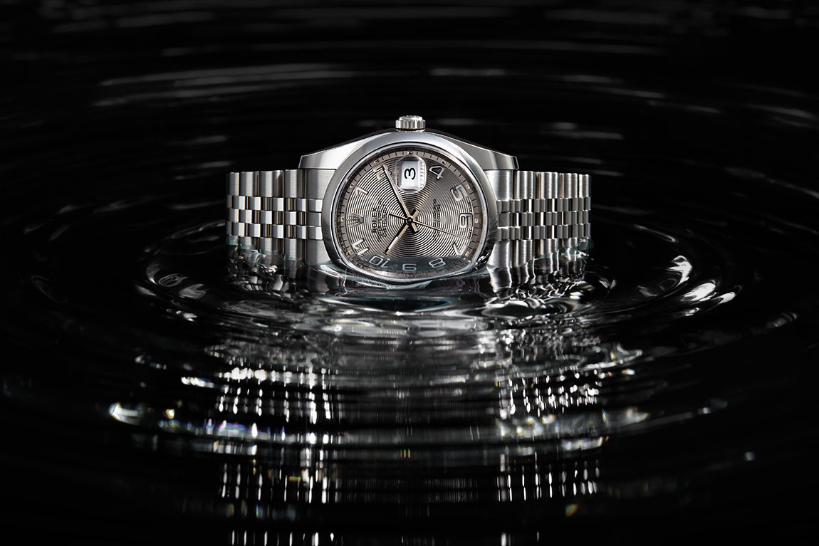Rolex wristwatch product photography in black water